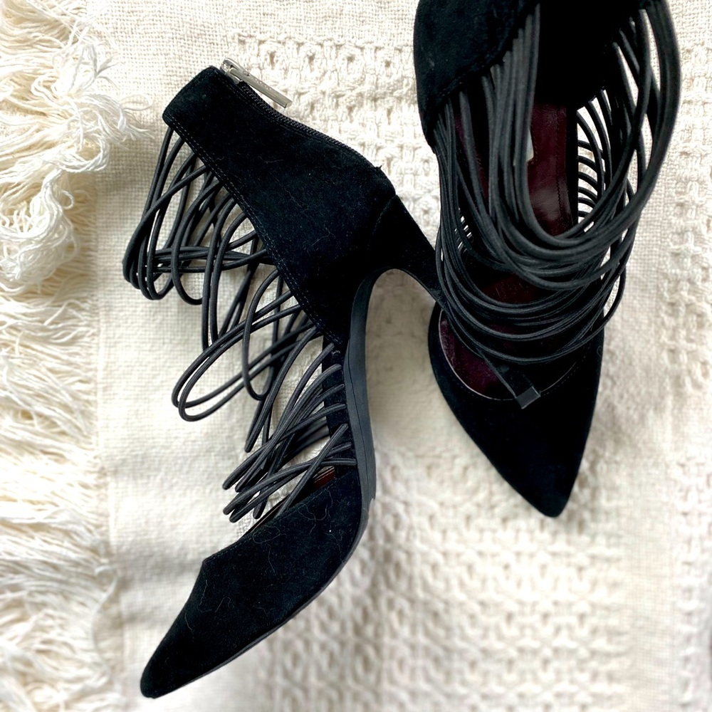 Black velvet heels with elastic bands and zip up ankle cuffs.